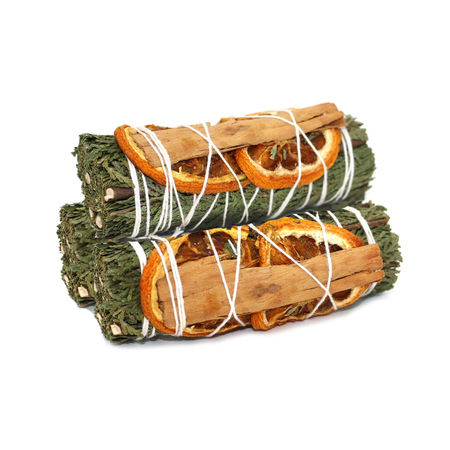 Two bundles of cedar and cinnamon sticks with orange slices tied together on a white background