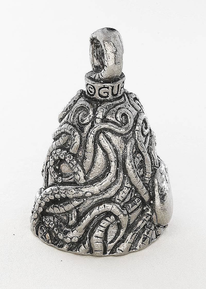 Silver bell-shaped pendant with intricate designs on a white background