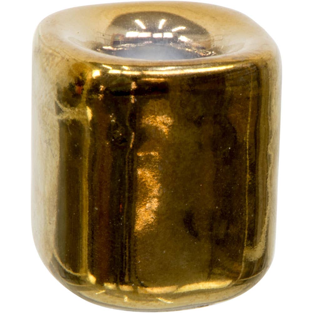 Gold-colored candle holder on a white background