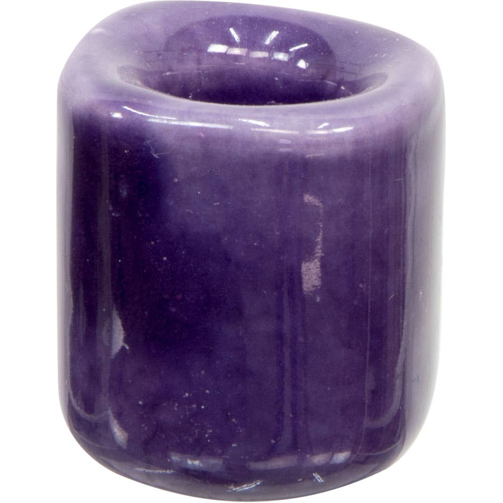 Purple candle holder on a white background