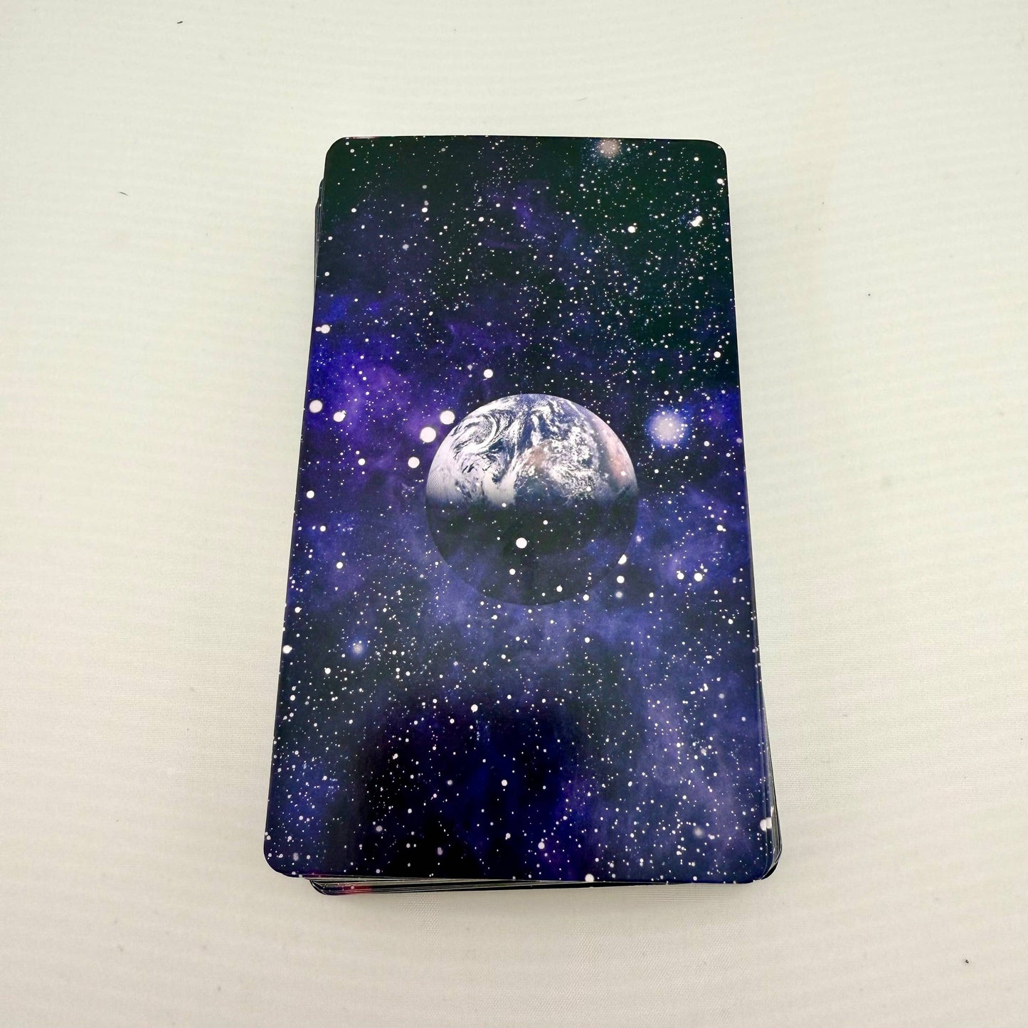 Tarot Cards with a space-themed featuring a planet on a white background