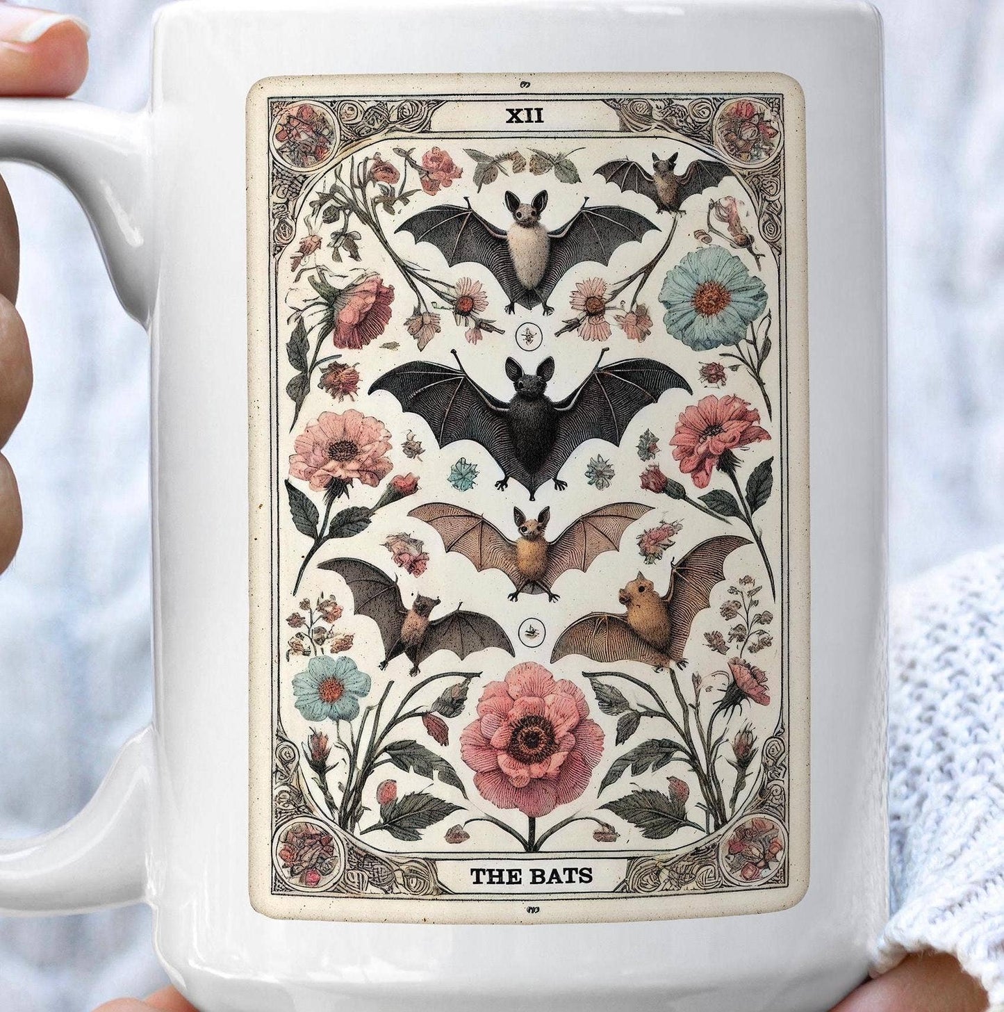 Mug with decorative design of bats and flowers on a white background