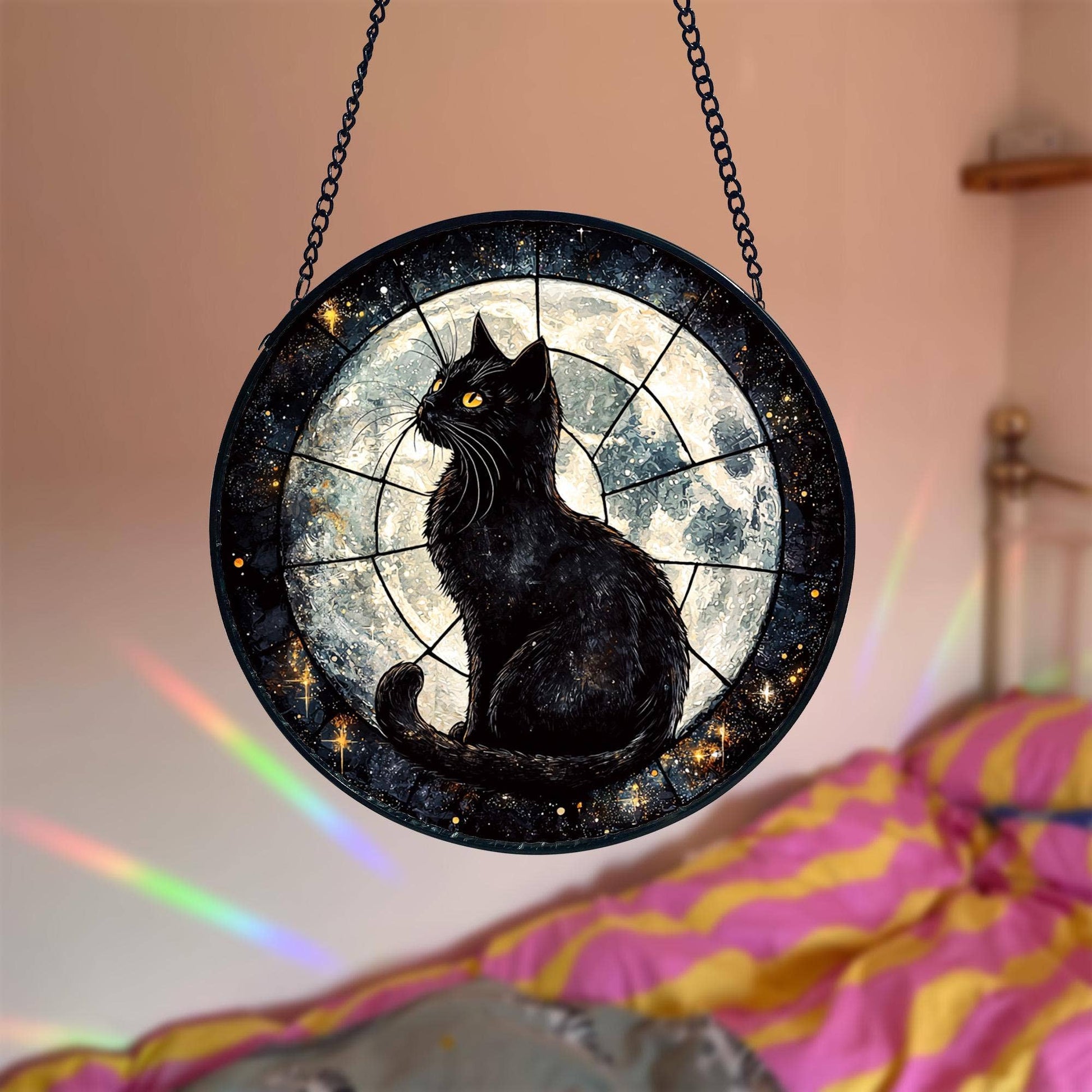 Decorative wall hanging with a black cat design against a starry night sky.