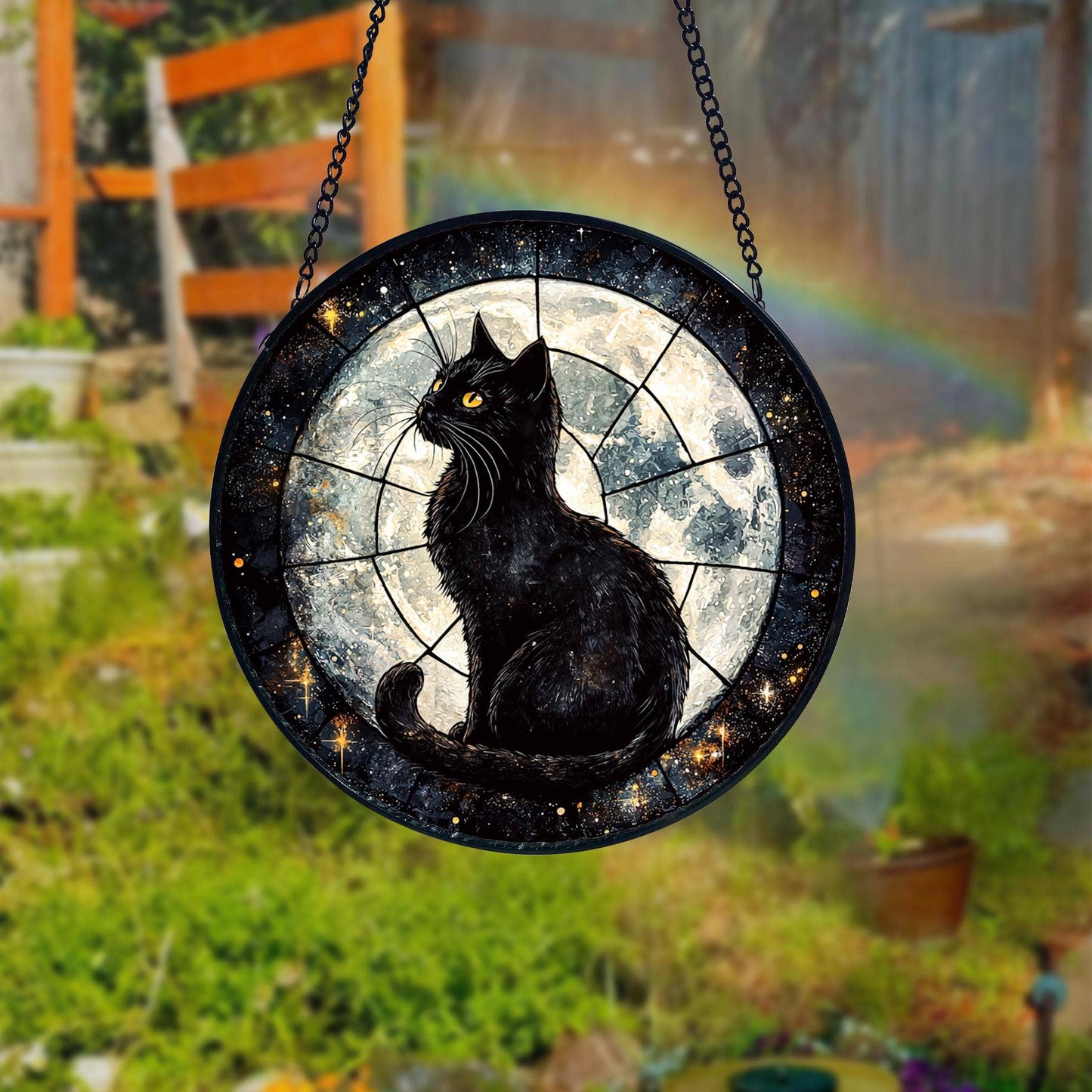 Decorative black cat with yellow eyes on a round, starry background hanging outdoors.