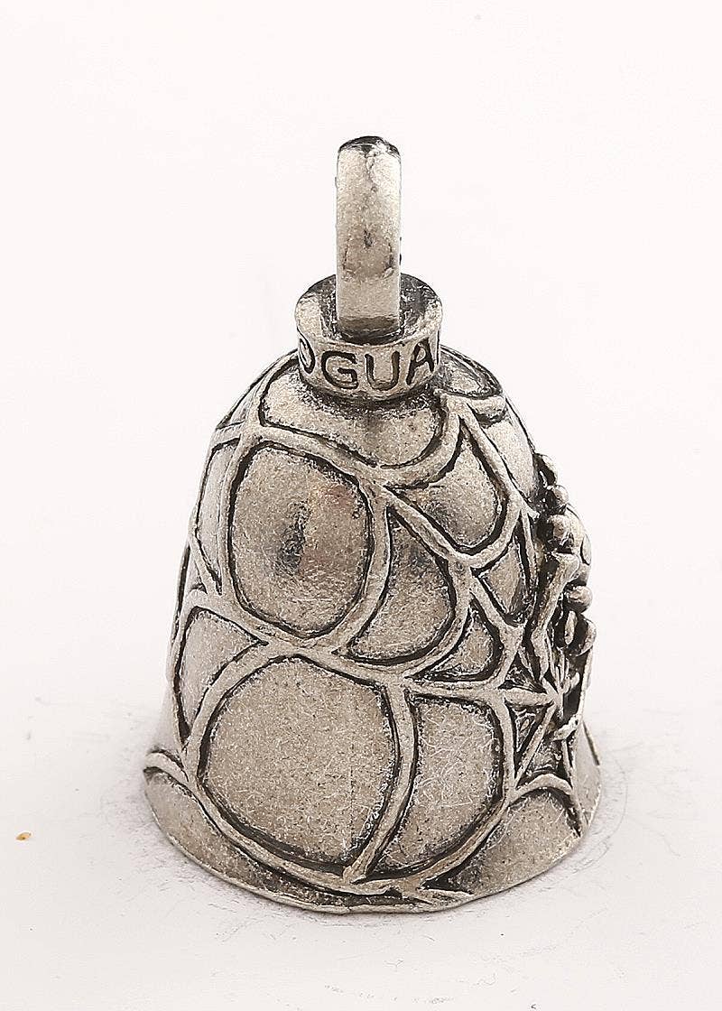 Silver cowbell with intricate design on a white background