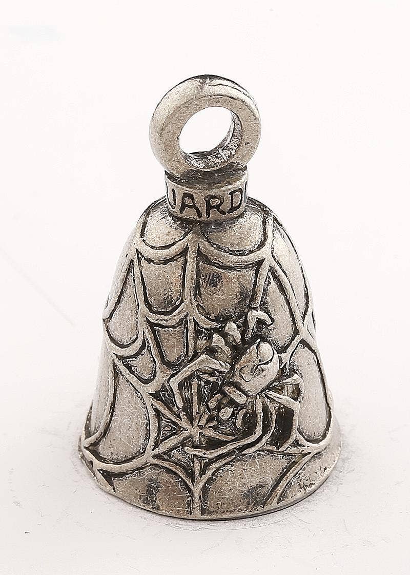 Silver bell with intricate design on a white background