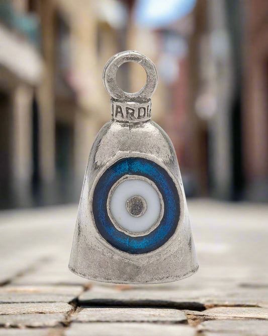 Silver bell charm with the evil eye design on a white background