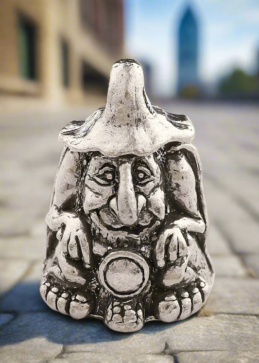 Silver fairy figurine with a pointed hat on a white background