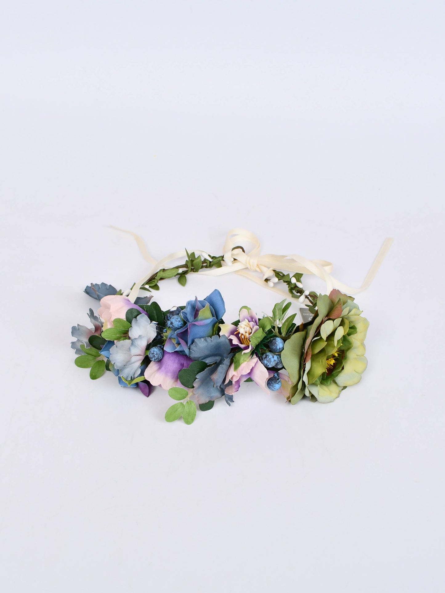 Floral headband with colorful flowers on a light gray background