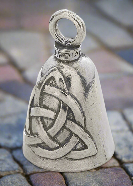 Silver bell with Celtic knot design on a white background