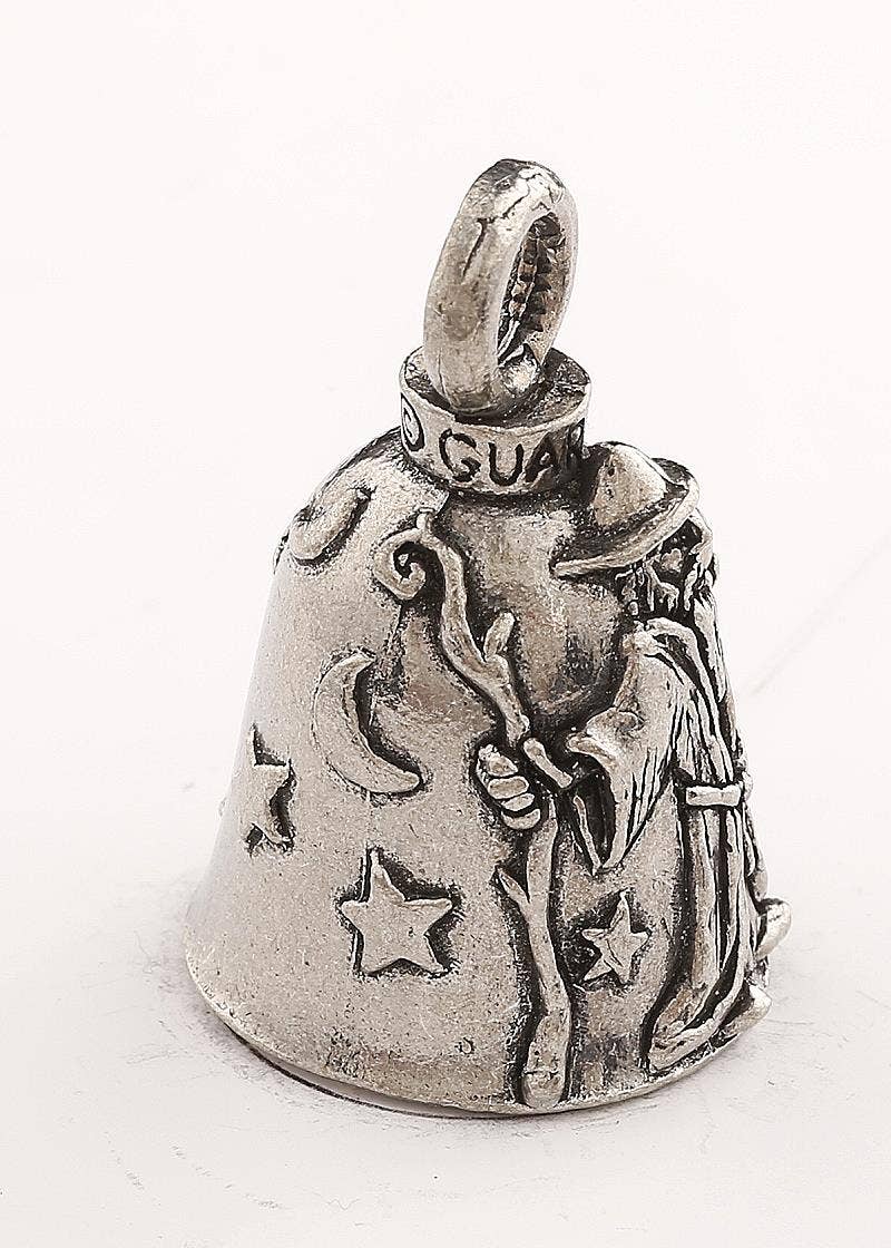 Silver bell with star and moon designs on a white background